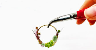 Miniature wreath by Deanna Kizis - close up with hands